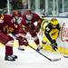 Michigan junior right wingman Luke Moffatt fights for a puck on the boards in the third period of the game against Ferris State on Friday, Mar. 1. Daniel Brenner I AnnArbor.com